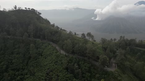 Aerial-tracks-motos-on-twisty-mtn-road-near-Mt-Bromo-volcano-on-Java