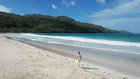 Woman-walking-on-one-of-the-most-beautiful-beaches-on-earth---Playa-Rincon-in-the-Dominican-Republic
