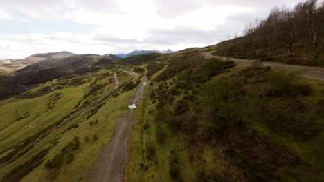 Aerial-Drone-Fly-Green-Climbing-Path,-European-Coto-Bello-Mountain-Peak-Asturias-Landscape-in-Spain