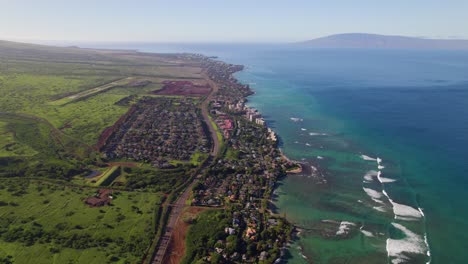 Condominium-apartments-along-coastal-highway-of-Kahana-Maui-with-Molokai-in-background