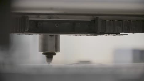Close-up-of-a-CNC-machine-in-operation-with-sparks,-precise-metalworking-process,-industrial-background