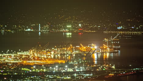 San-Francisco-busy-cargo-marina-port-at-night-time-lapse-moving-ships-USA