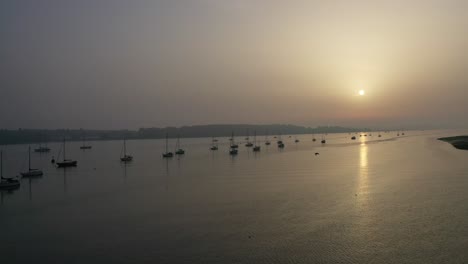aerial-footage-moving-slowly-sideways-into-the-channel-of-the-river-orwell-at-sunrise