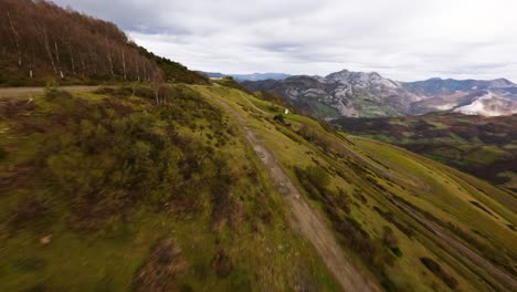 Aerial-Drone-Fly-Through-European-Peaks-Coto-Bello-Mountain-Trekking-Wild-Path,-Fast-FPV-Landscape