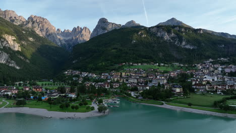 Molveno-establishing-aerial-view-circling-picturesque-Dolomites-lake-Molveno-mountain-commune