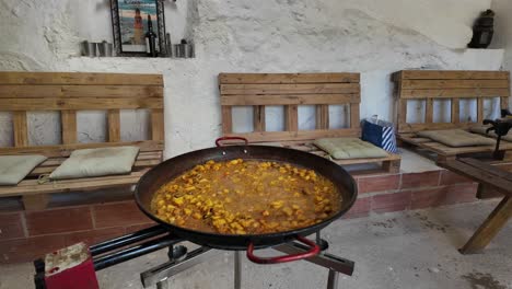 Cooking-a-traditional-seafood-spanish-Paella-inside-a-traditional-historical-beach-restaurant-in-Valencia-city