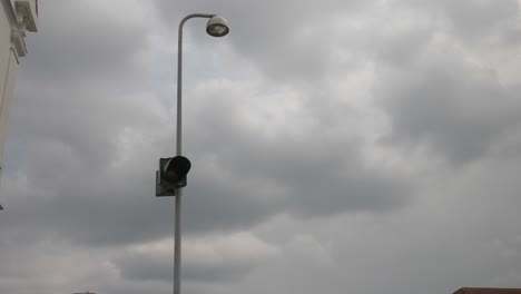 Street-light-flashes-orange-in-cloudy-weather