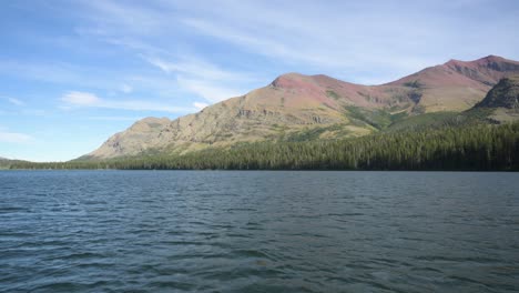 Two-Medicine-Lake-in-Glacier-National-Park-viewed-from-boat,-pan