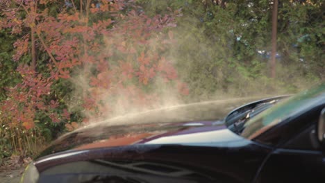Water-vapor-coming-out-of-the-hood-of-a-car-in-slow-motion-as-it-defrosts