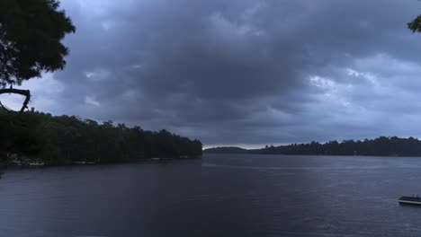 Timelapse-of-a-Heavy-Rainstorm-with-Lighting-Sweeping-Over-a-Lake