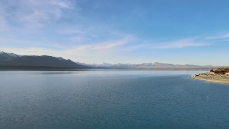Drone-point-of-view-of-Mount-Cook-mountain-range-with-the-beautiful-turquoise-waters-of-Lake-Pukaki,-South-Island,-New-Zealand