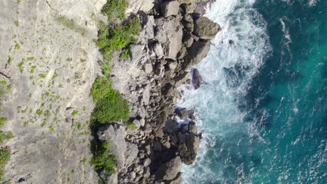 Top-View-Of-Towering-Cliffs-On-The-Shore-Of-Porte-d'Enfer,-Guadeloupe,-France
