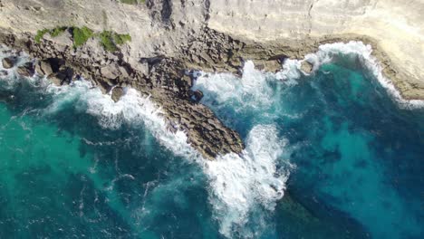Above-View-Of-Turquoise-Waters-Breaking-On-Rugged-Cliffs-In-Porte-d`Enfer,-Guadeloupe-France