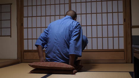 Man-is-taking-Zazen-half-lotus-position,-embracing-a-serene-posture-of-meditation-for-inner-contemplation-and-tranquility