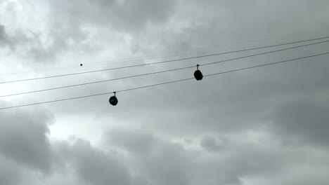 Looking-Up-At-Singapore-Cable-Car-Against-Cloudy-Sky-In-Singapore---Low-Angle