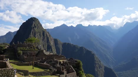 Beautiful-view-of-the-mysterious-Inca-ruins-of-Machu-Picchu-shrouded-in-clouds-in-the-Andes-mountains,-Cusco-Region,-Peru