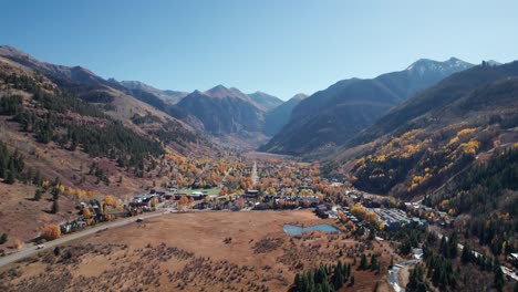 Distant-drone-aerial-view-over-telluride,-CO-city-in-the-fall-on-a-sunny-day