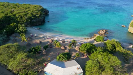 Aerial-establish-above-hidden-tropical-paradise-cove-of-Daaibooi-beach-Curacao