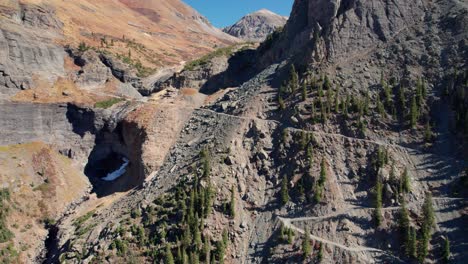 Close-up-drone-shot-scaling-up-the-mountainside-of-Black-Bear-Pass-in-Telluride