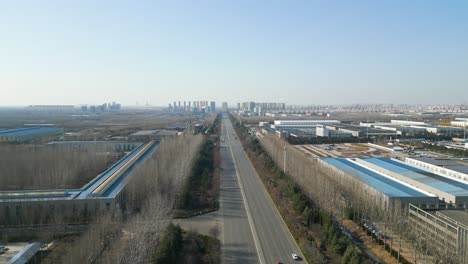 Aerial-shot-revealing-industrial-area-with-Chinese-factories-in-the-outskirts-of-Linyi,-Shandong-Province,-China