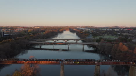 Aerial-of-early-morning-aerial-shot-of-river-with-three-bridges-crossing-it