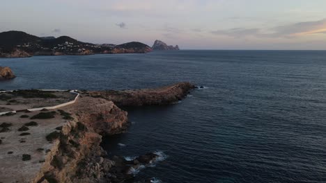 aerial-tour-of-cliff-facing-the-island-of-Es-Vedrá-in-Ibiza