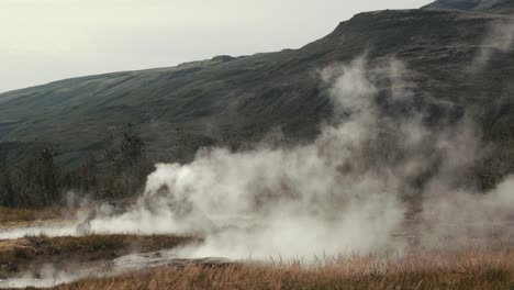 Hot-steam-rising-from-Geysir-boiling-geothermal-hot-spring-water-boiling-on-golden-circle,-strokkur-Iceland