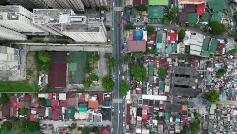 Dense-residential-area-in-west-crame,-quezon-city,-philippines,-showcasing-varied-rooftops,-streets,-and-urban-planning,-aerial-view