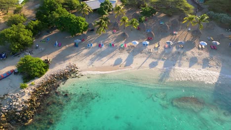 High-angle-overview-of-whitewash-waves-crashing-on-luxurious-tropical-Caribbean-paradise-shoreline