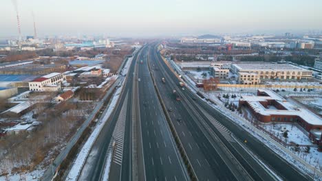 Aerial-view-of-Qingdao-Yinchuan-Expressway-near-Zibo-City-during-sunset-hour-in-winter-time