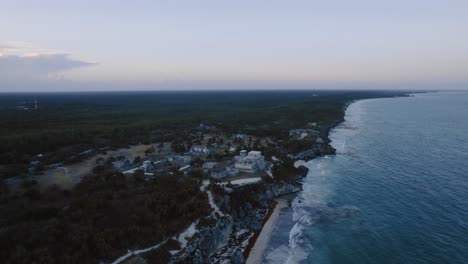 spectacular-bird's-eye-view-of-the-Tulum-Ruins,-lining-up-the-sea-with-the-horizon
