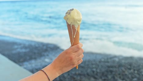 Melting-ice-cream-treat-feasting-at-beach-Las-Galletas-Tenerife-Spain
