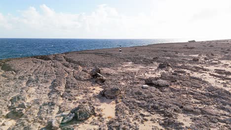 Aerial-orbit-along-sand-on-rocky-tendrils-of-Northside-Curacao