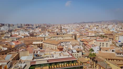 Panoramic-video,-urban-landscape-of-the-historic-Andalusian-city,-Malaga,-Spain