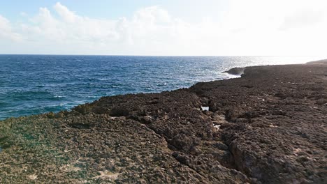 Jagged-eroded-cliffs-from-stong-ocean-waves-on-northside-of-Curacao-at-midday