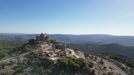 Our-Lady-of-Cabeza-pilgrim-basilica-amid-Andalusian-landscape-AERIAL-PULL