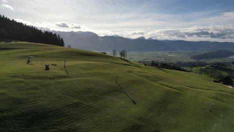 Cinematic-Wide-Establishing-Drone-Shot-of-Bare-Ski-Lift-on-Hill-in-Summer,-Switzerland