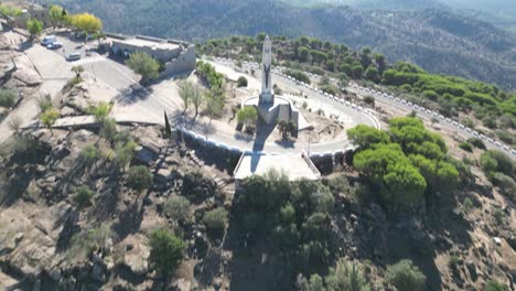 Aerial-reveal-of-Virgin-Mary-Statue-at-Our-Lady-of-Cabeza-basilica-Andalusia-Spain