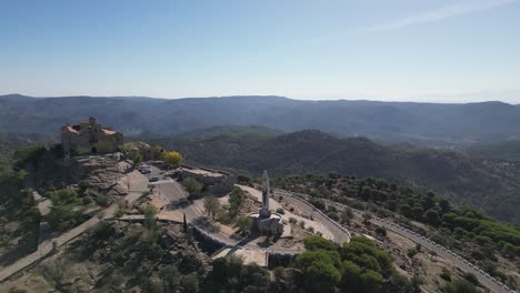 Spanish-hilltop-basilica-Our-Lady-of-Cabeza-amid-beautiful-Andalusian-landscape-AERIAL