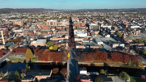 High-aerial-truck-shot-of-small-American-city-in-autumn