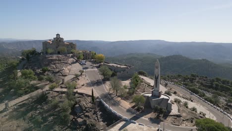 Statue-Of-Nuestra-Senora-De-La-Cabeza,-Spain-Hilltop-Shrine-Andalusía-Mountains-Aerial