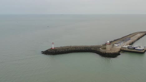 Serene-aerial-gliding-towards-the-Howth-harbour-lighthouse