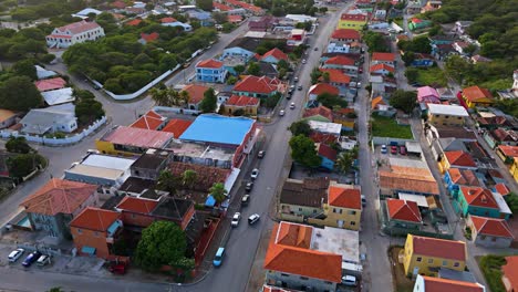 Aerial-panoramic-establishes-orange-multi-colored-roofs-of-Roodeweg-Otrobanda-Curacao-in-shade