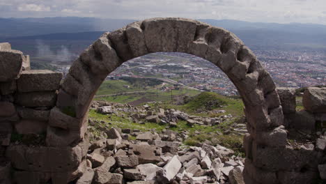 Stone-arch-overlooking-a-city-landscape-in-Pergamum