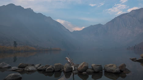 Boats-Cruising-At-Sunrise-On-Convict-Lake-In-Fog-With-Laurel-Mountain-In-Background