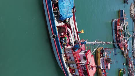 Aerial-Flying-Over-Moored-Fishing-Boats-In-Port-Of-San-Antonio-In-Chile