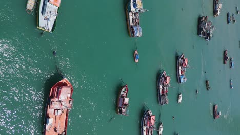 Aerial-View-Over-Moored-Fishing-Boats-In-Port-Of-San-Antonio-In-Chile