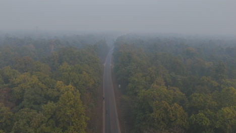 Drone-shot-of-highway-in-Terai-Nepal-where-vehicle-travels-East-West-regional-landscape
