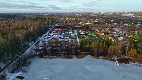Aerial-view-of-a-snow-dusted-village-landscape-in-Latvia-Jelgava