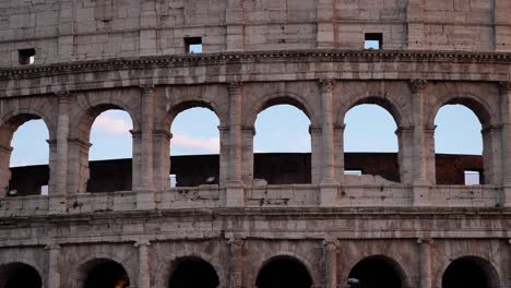 Detailed-outside-view-of-the-Colosseum-at-sunset,-Rome,-Italy